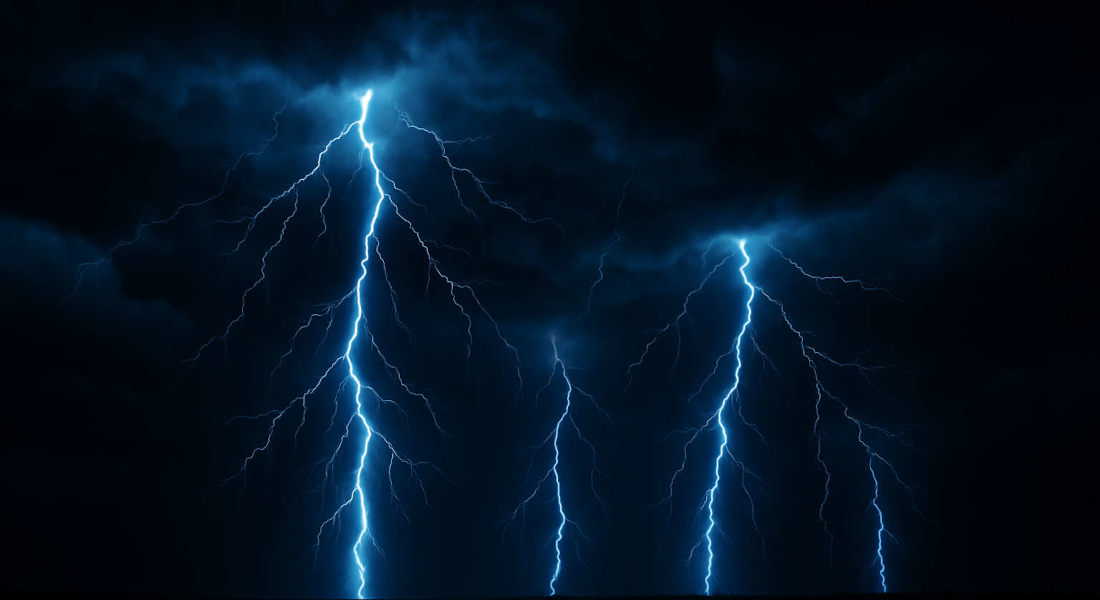 Blue lightning bolt over dark clouds
